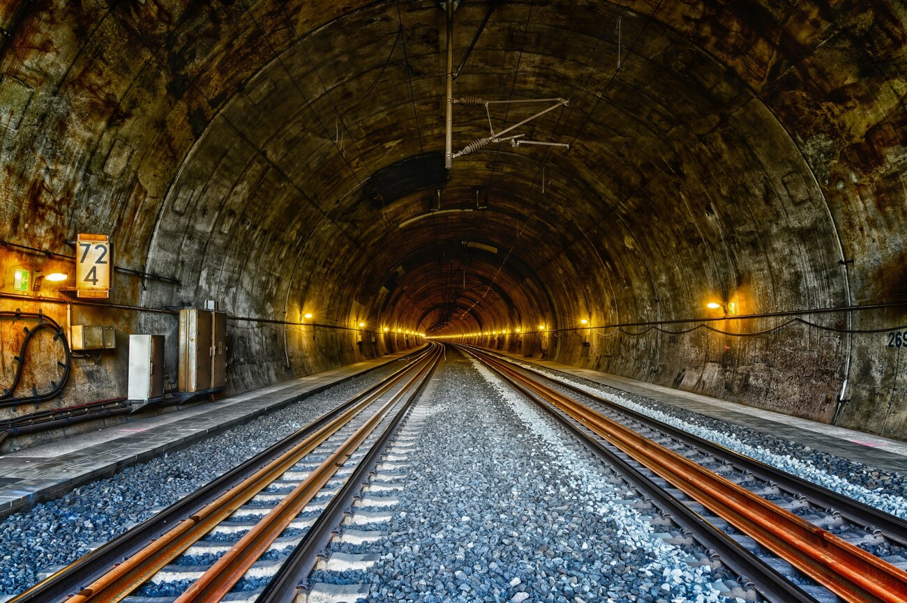 railway tunnel showing tracks disappearing into the distance