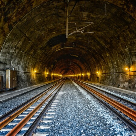 railway tunnel showing tracks disappearing into the distance