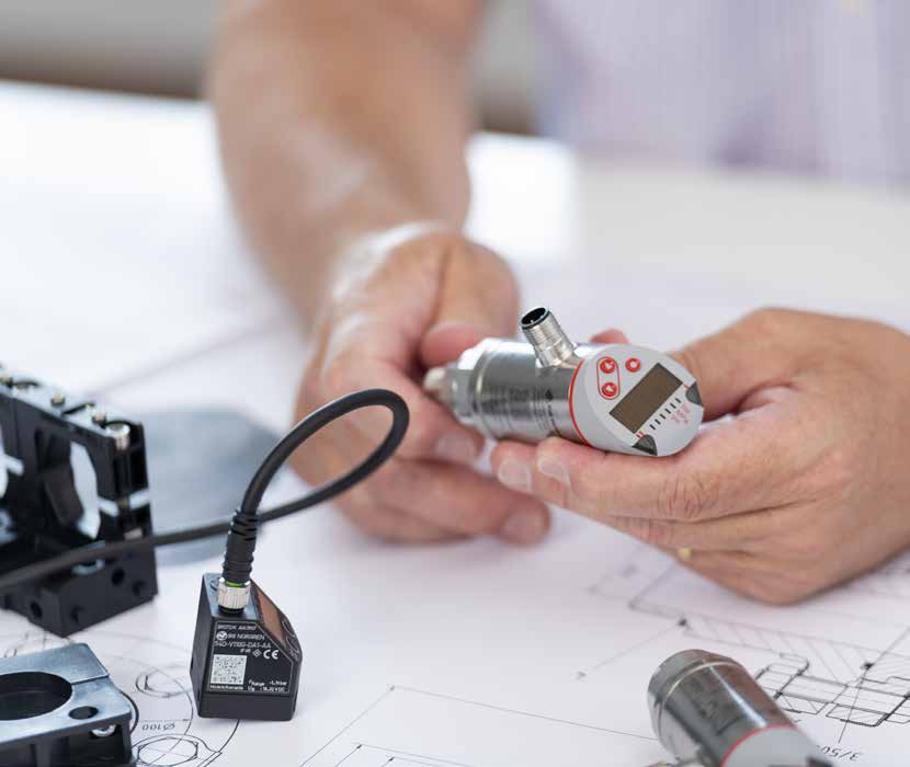 male hands examining a pneumatic pressure switch