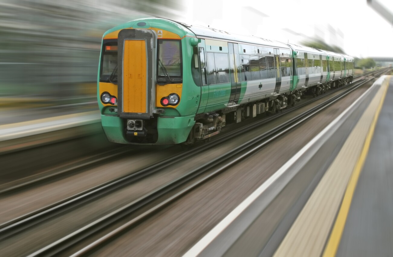 train captured travelling through a train station