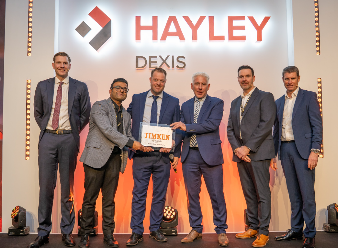 A team from HAYLEY DEXIS and Timken meet to announce the new partnership.
