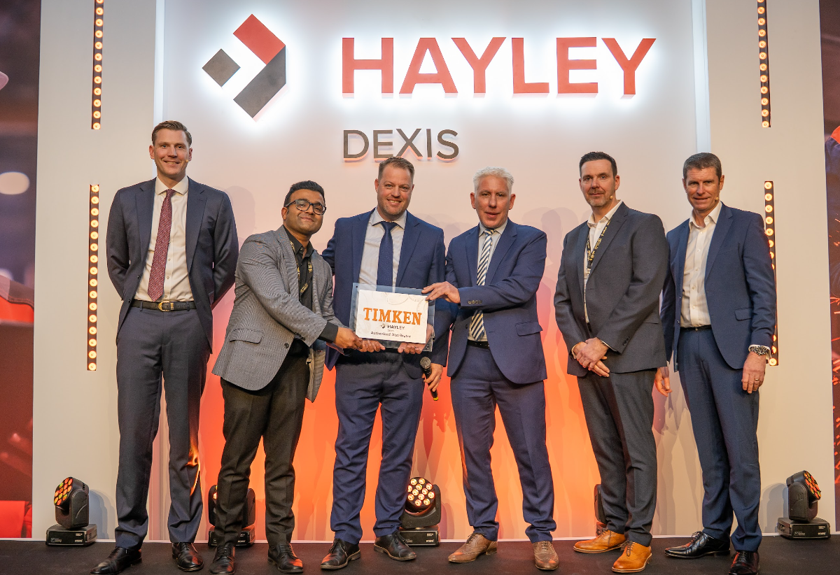 A team from HAYLEY DEXIS and Timken meet to announce the new partnership.